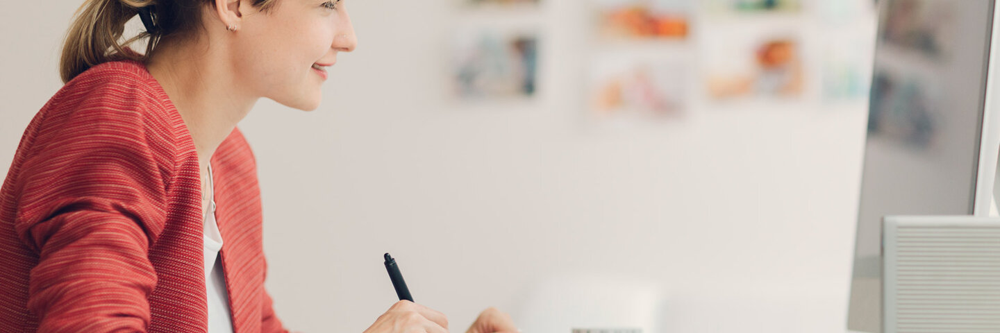 woman working with stylus and computer