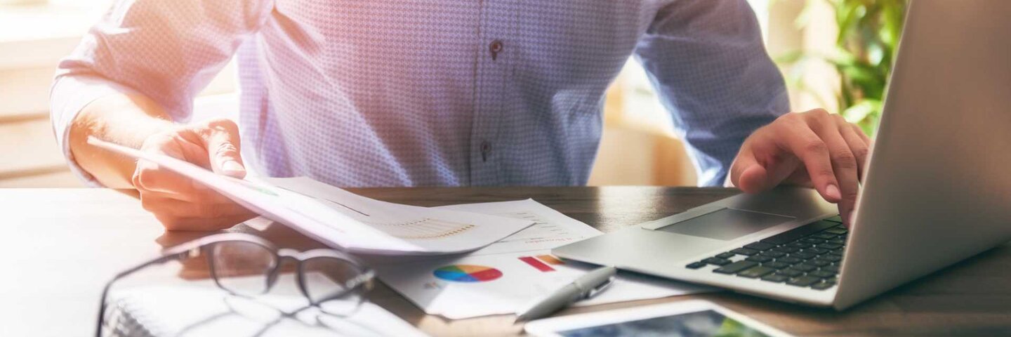 Man working on financials in office