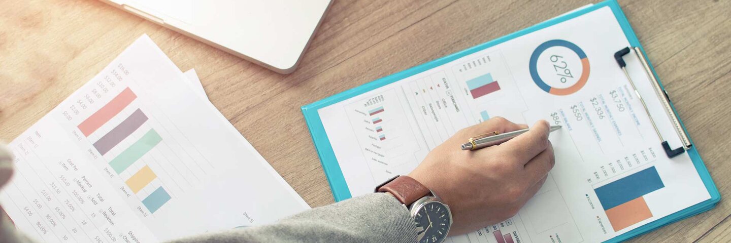 Businessman analyzing investment charts.