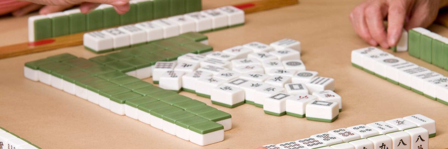 mature adults playing mah jongg