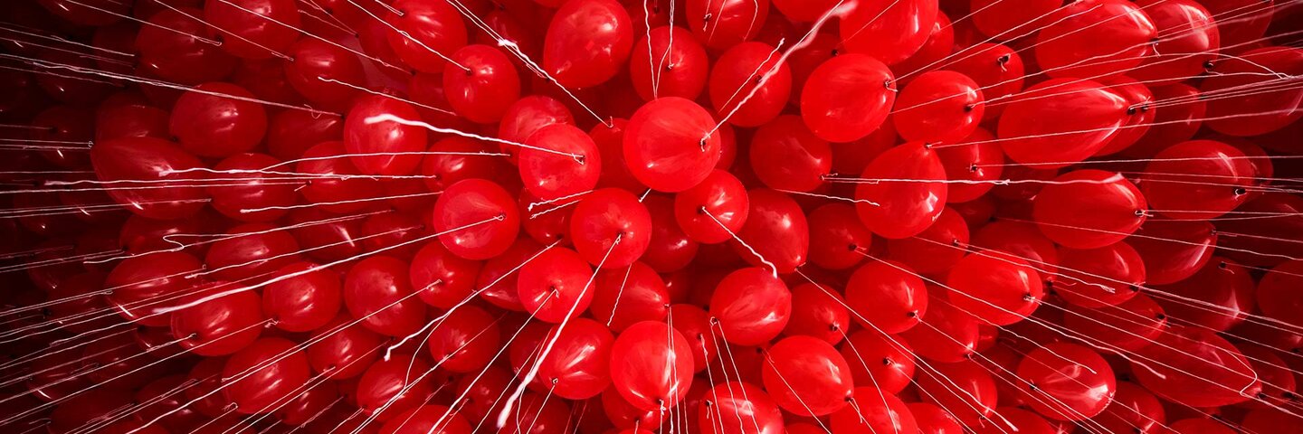 Full Frame Shot Of Red Helium Balloons Against Ceiling in A Coruña, Spain.