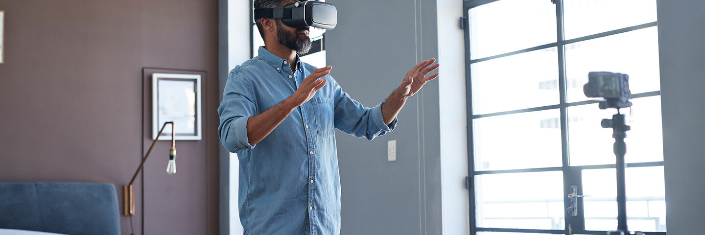 Man using a virtual reality headset in his apartment