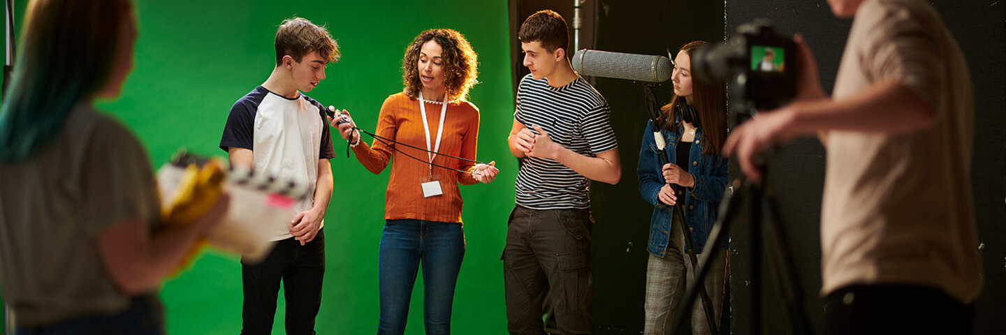 filmmakers working in front of a green screen