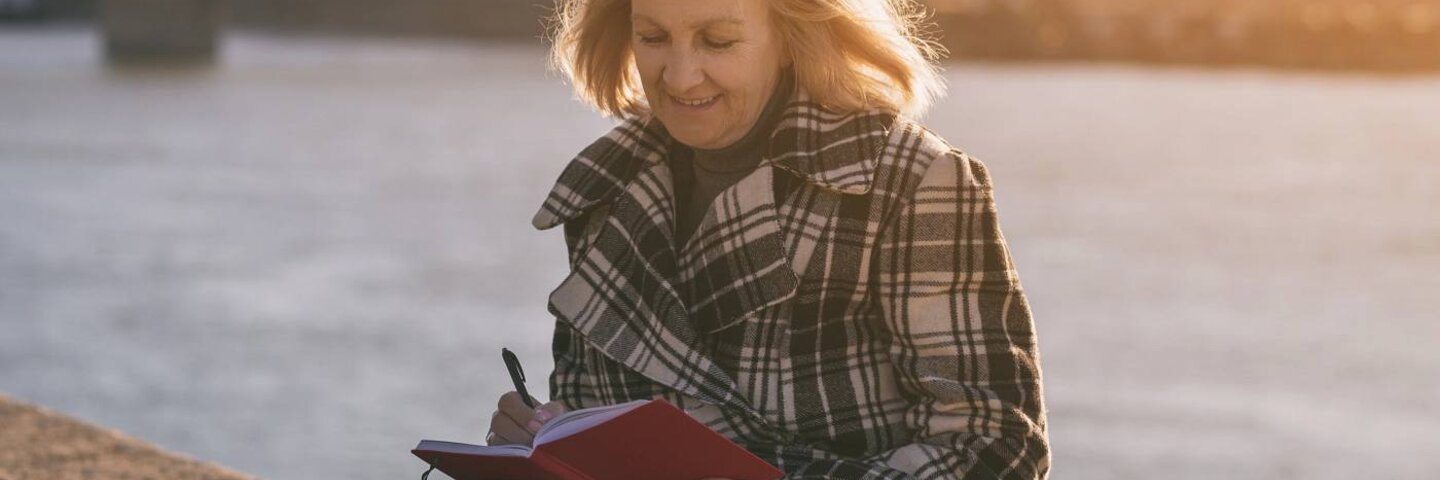Senior woman writing
