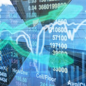 computer screen with stock prices and graphs