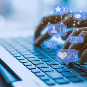 businesswoman on a laptop using social media